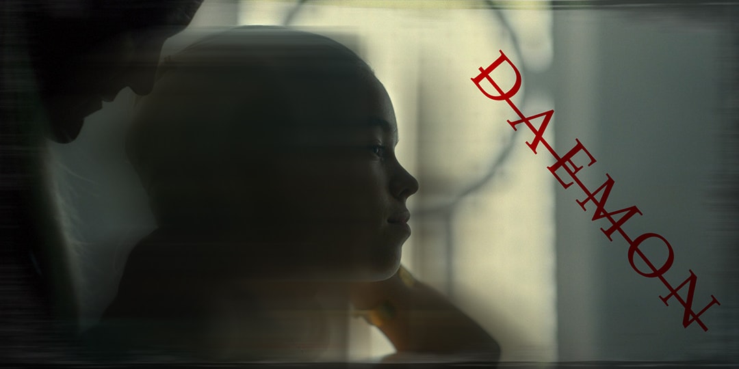 Daemon Targaryen in profile at a window, backlit, with 'DAEMON' lettered in red across the frame.